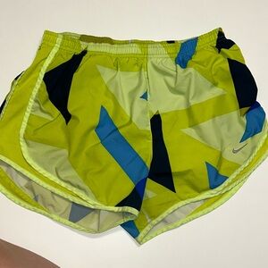 Women’s green and blue Nike running shorts with geometric design. Size Large
